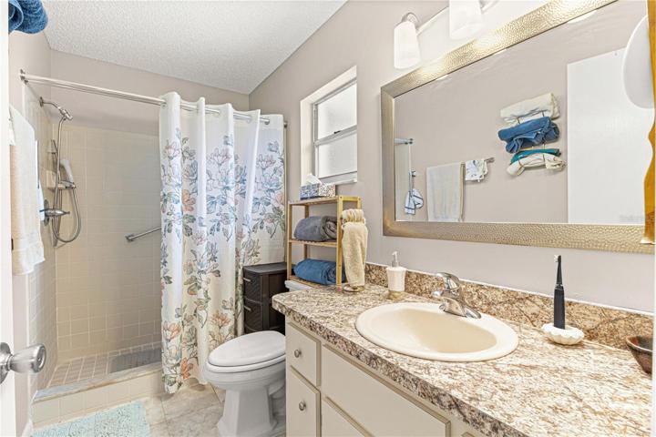 En Suite Bath with Step-In Shower & Upgrades