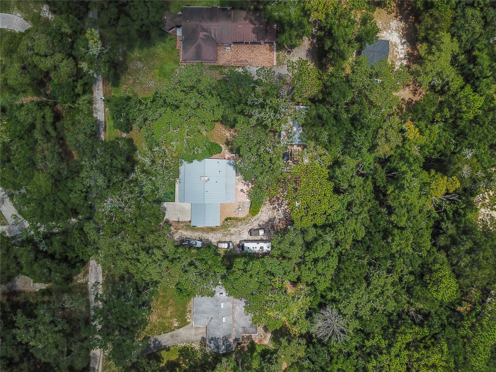 Your own personal oasis among the trees, this updated home on a large lot also has a NEWER A/C (2022), water heater (2018) and lots to love! Call today to schedule your private tour!
