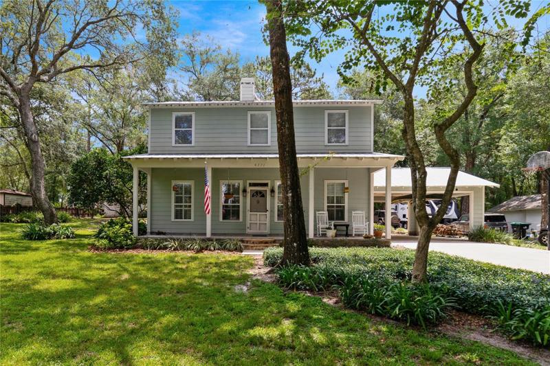 Custom built one owner home in the Rock Springs area of Apopka with a gorgeous KITCHEN and FAMILY ROOM REMODEL, tile/wood floors and crown molding throughout all on a sprawling 1/2 ACRE LOT with a detached GARAGE/WORKSHOP and 50/Year METAL ROOF!