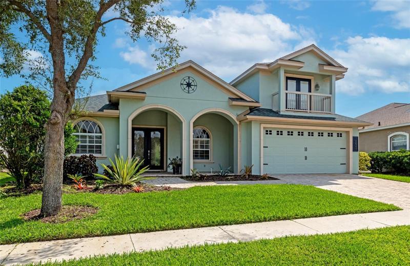 New roof, paver driveway and extensive real stone trim make for great curb appeal.