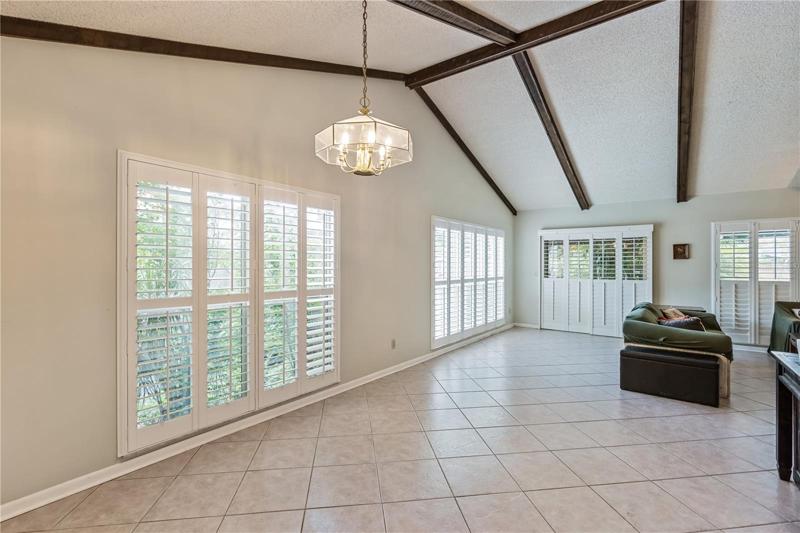 Gorgeous vaulted ceilings and plantation shutters.