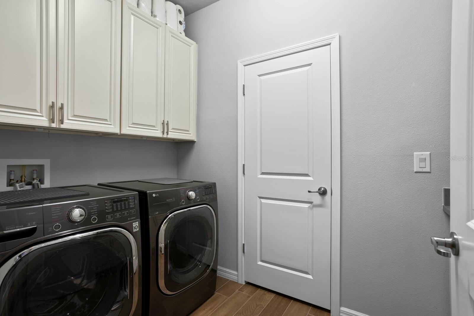 Large laundry room with upgraded cabinets