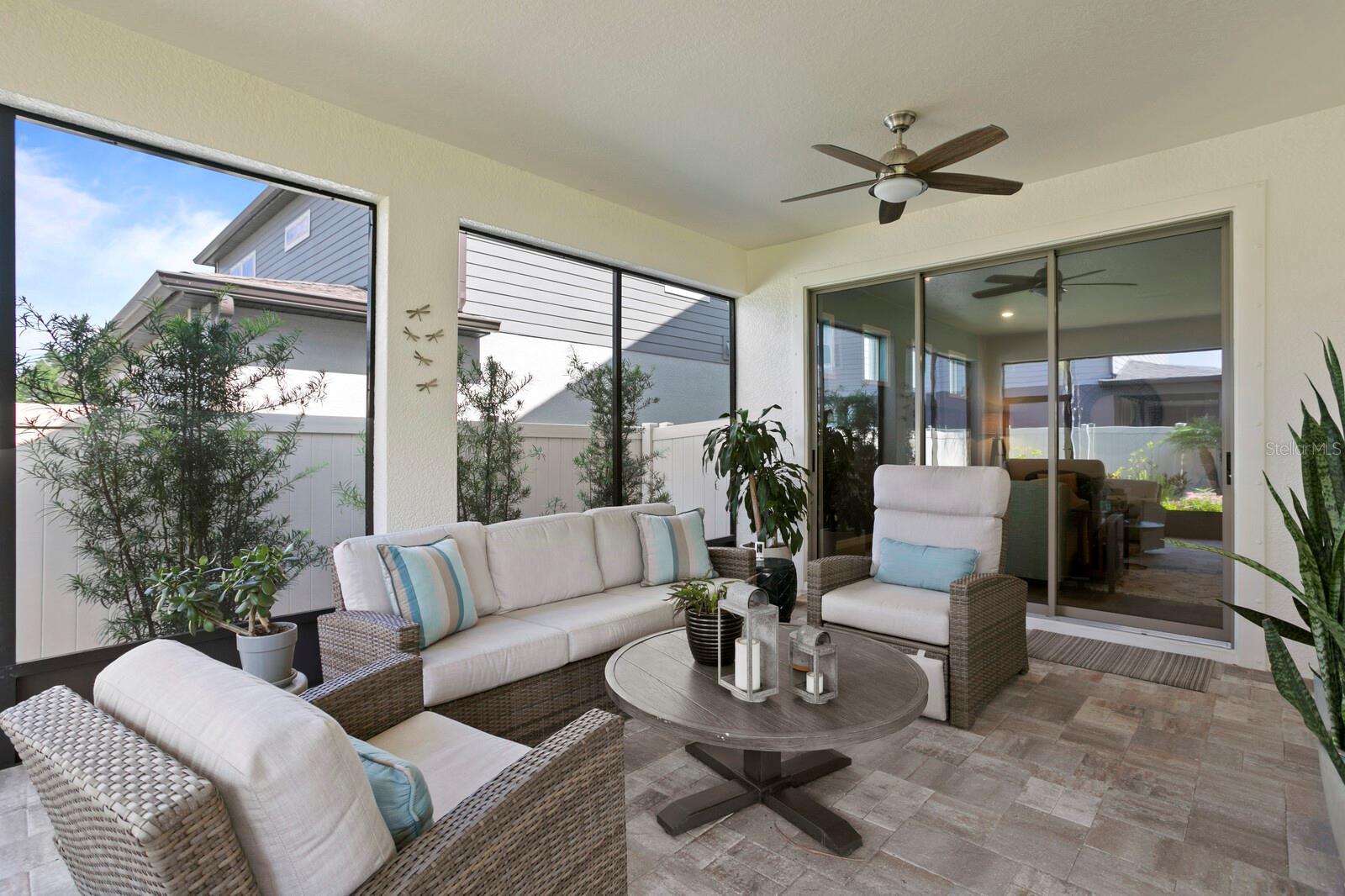 The lanai includes pavers and ceiling fans