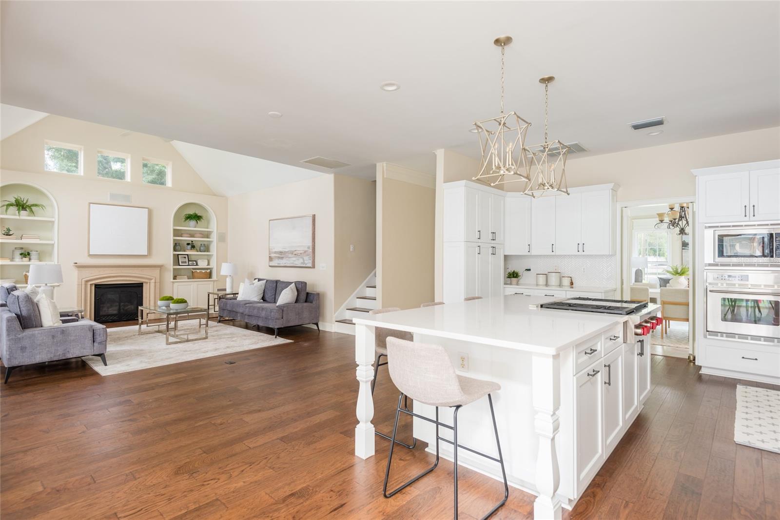 Kitchen open to family room and screened porch