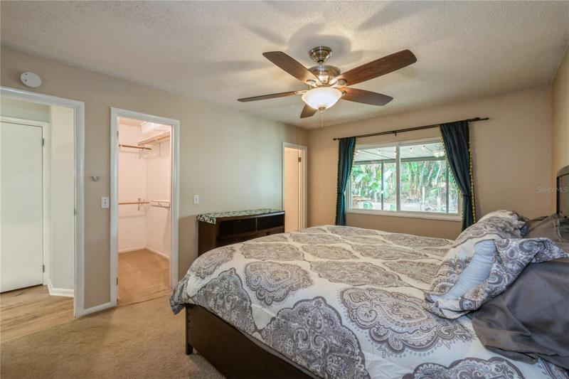 View of Owner's Suite with Walk in Closet and En Suite Bathroom