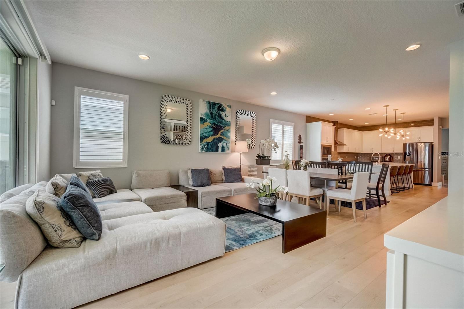Experience the luxury of a sprawling open floor plan that seamlessly integrates the living area with the kitchen. This thoughtfully designed space offers an abundance of room, allowing for effortless flow and easy interaction between family and friends. Enjoy the freedom to entertain and relax in style as the boundaries between living and culinary spaces blur, creating a truly inviting atmosphere.