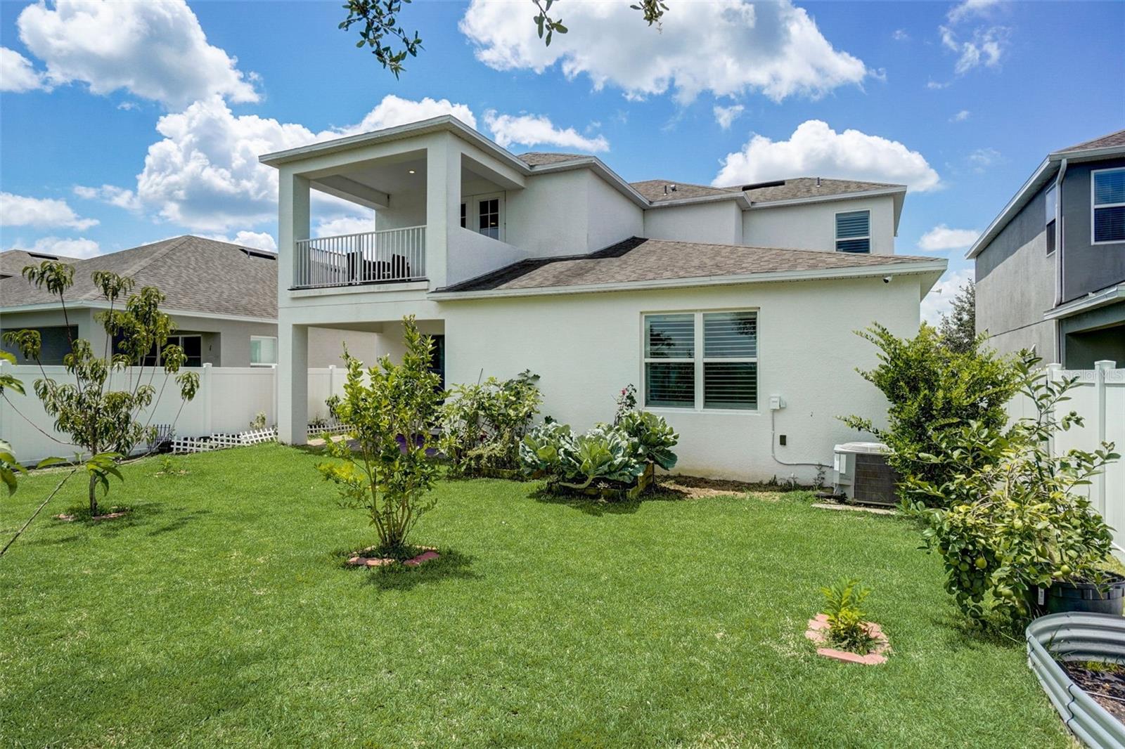 Embrace the enchantment of the 2nd floor outdoor balcony, overlooking the captivating backyard garden. Let the beauty of the surroundings inspire and rejuvenate you, as you bask in the tranquility and serenity that this elevated retreat offers.