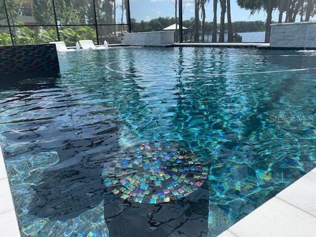 Utilize the in-pool swim-up barstools and soak in the sun