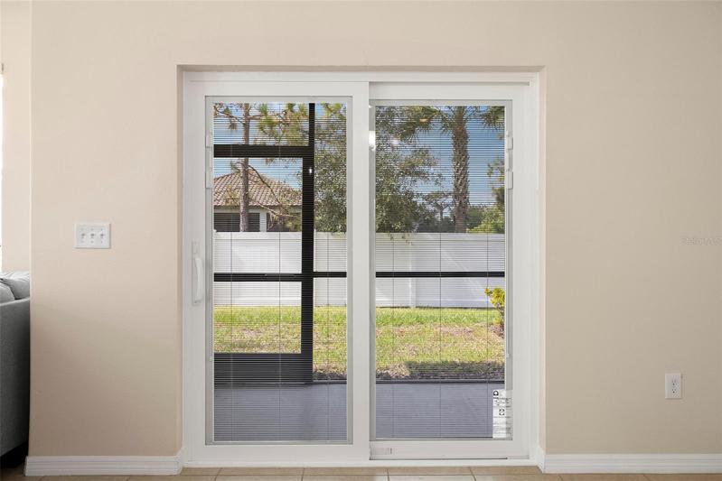 Brand New Pella Sliding Glass Doors with Integrated Blinds that will never need to be cleaned! Amazing features on these High End Pella Windows and Doors! No more clanking with Vertical Blinds!  You will love them!