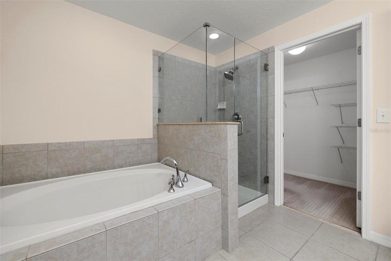 Master Bathroom has Deep Garden Tub and Walk in Shower with Brand New Frameless Glass!