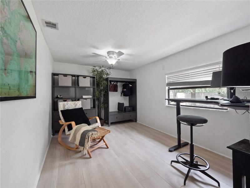The optional office/playroom located to the back left of the home off the game room has a door to close it off from noise.
