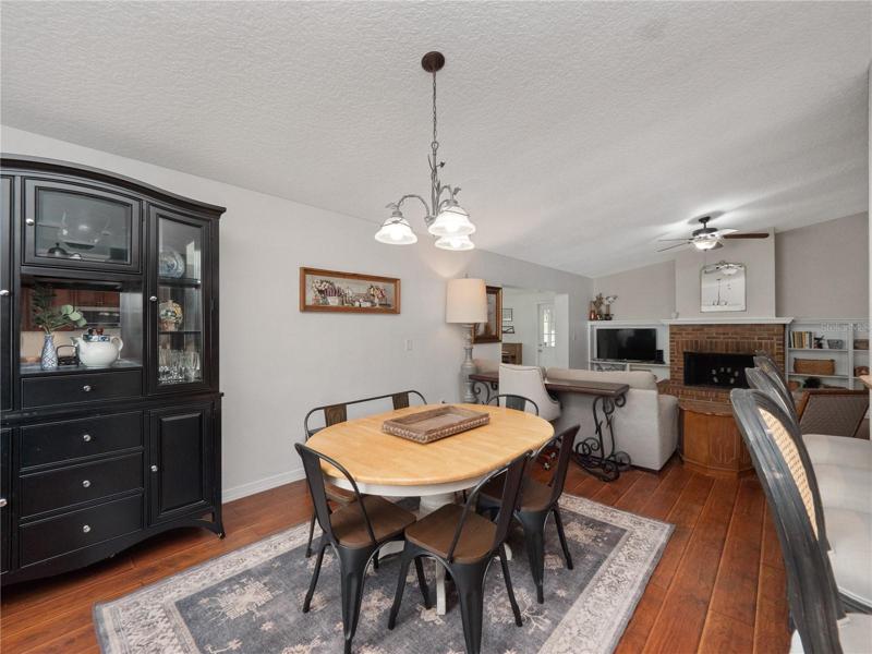 The dining room is open to the kitchen and family room and can accommodate a large table for family gatherings .