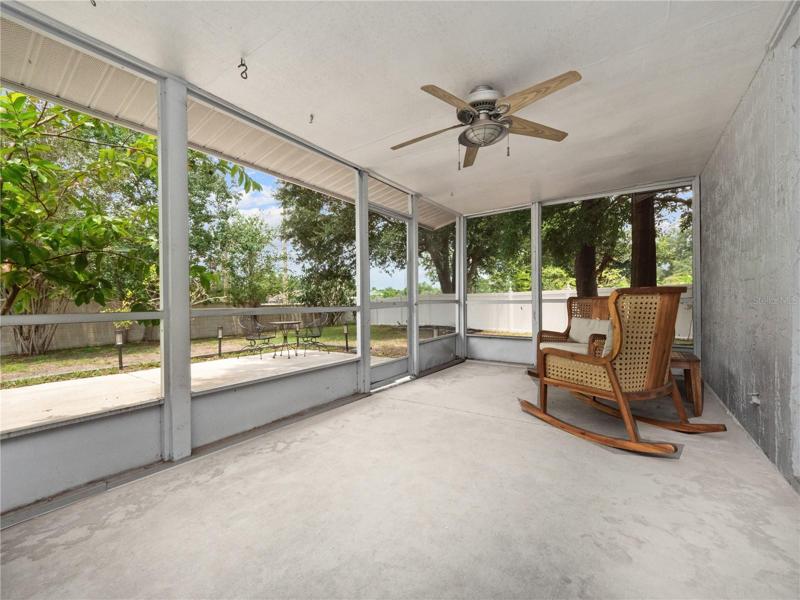 Enclosed lanai with access to the backyard, primary suite and game room.