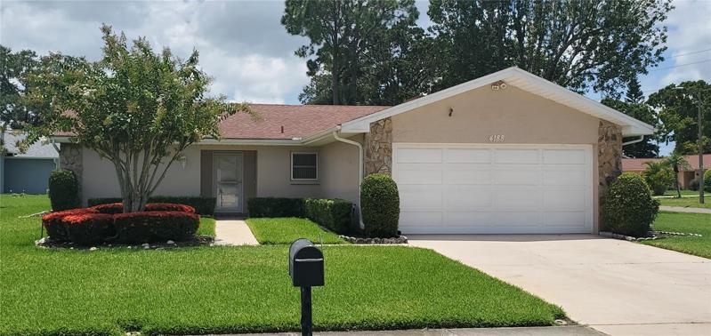 Clean curb appeal with well kept grounds