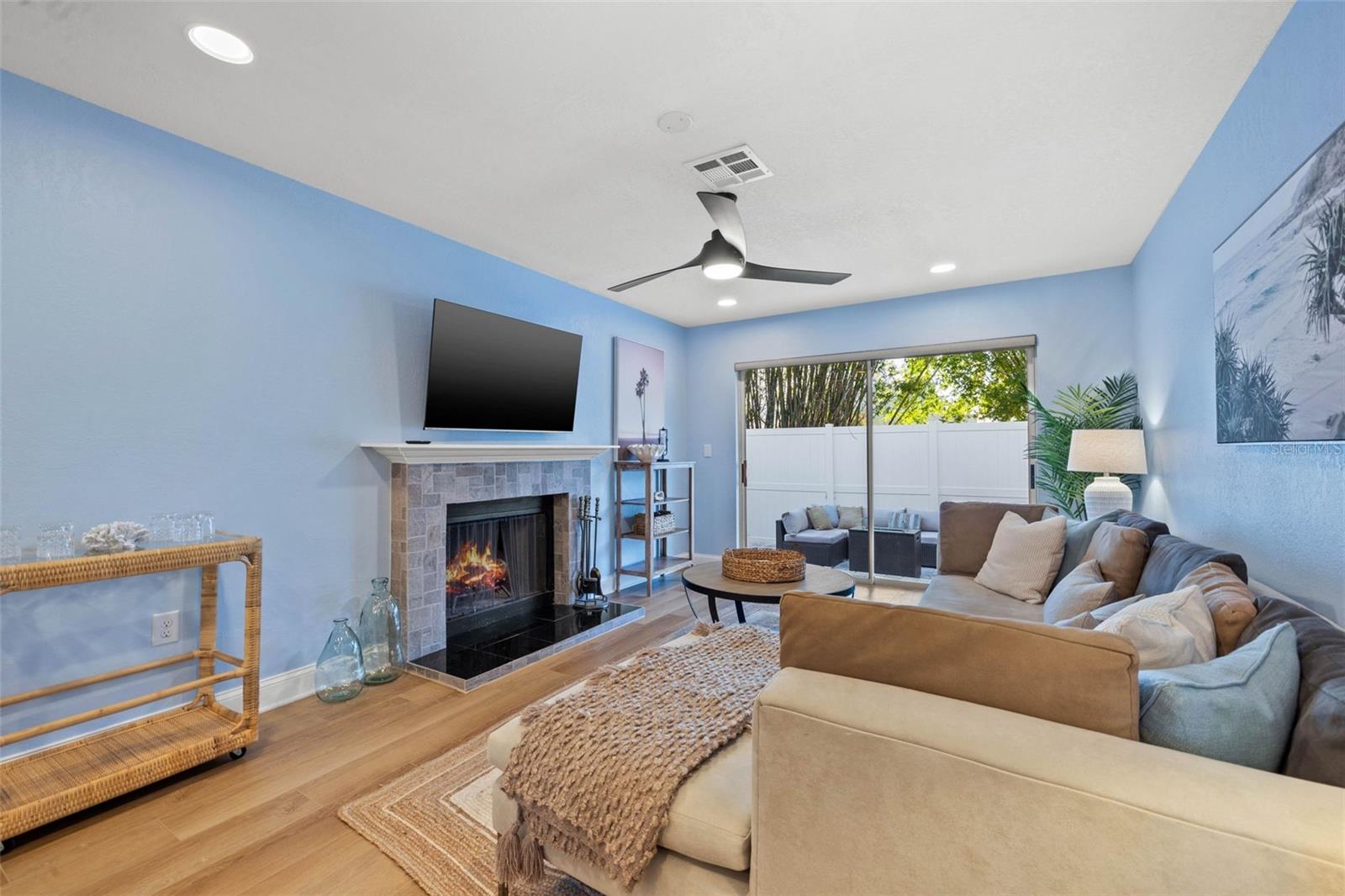 directly off the kitchen is the den and patio space.