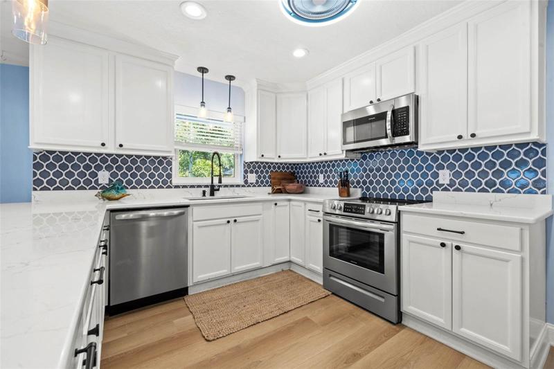 Quartz counters and stainless appliances.
