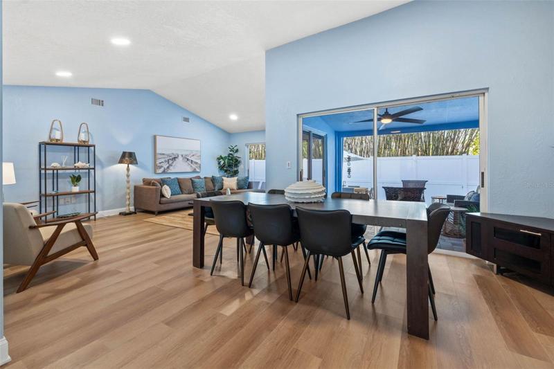 Formal dining with patio and pol access.