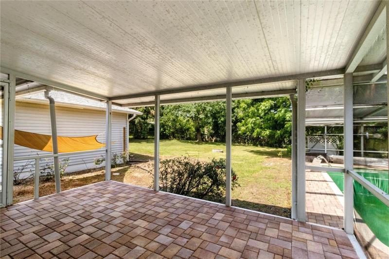 Raised screed porch off eat in kitchen
