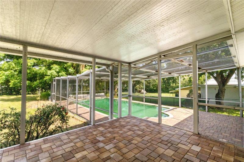Screened Porch and separate screened lanai with pool