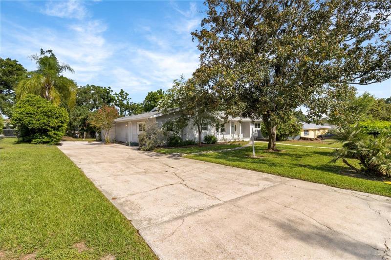 Extra long driveway to side load garage.