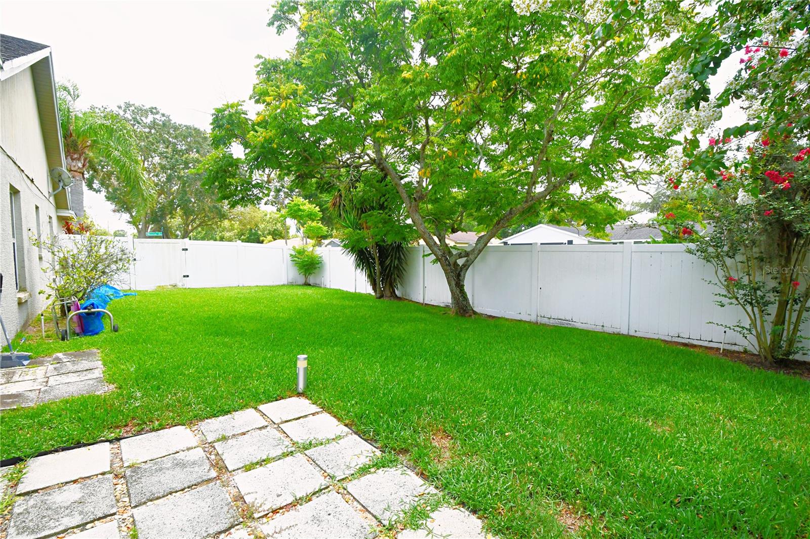 Additional privacy on the beautifully manicured side yard.
