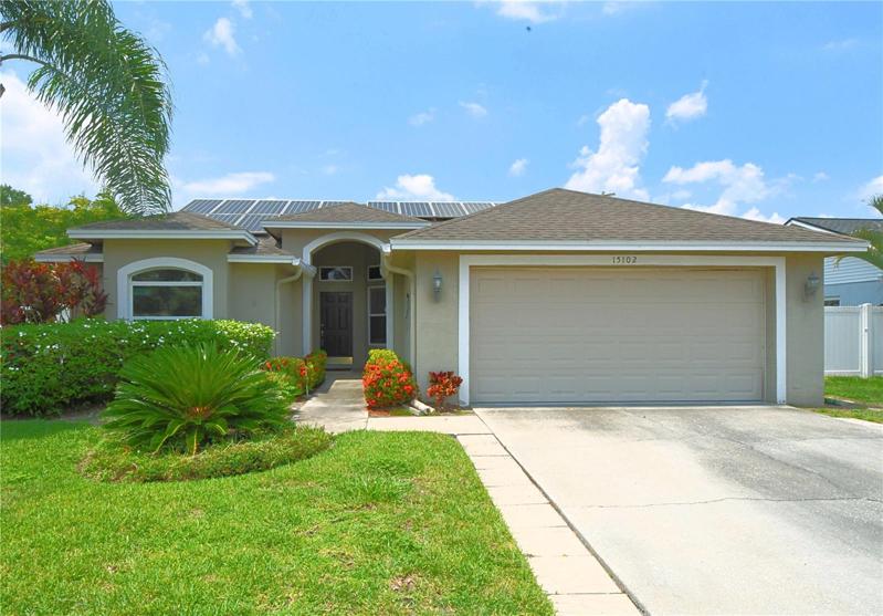 Lushly landscaped entryway.