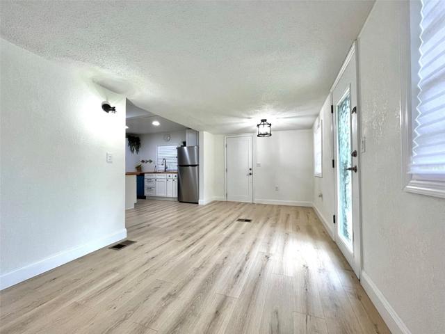 Living room facing side entry/ kitchen