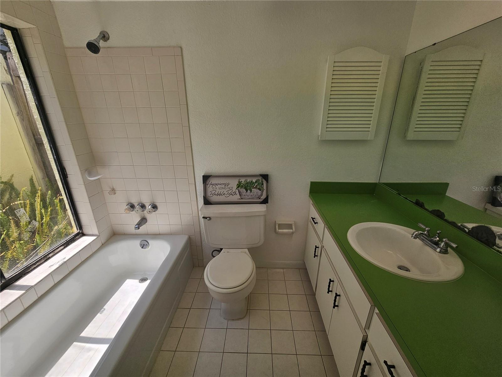 Master Bathroom overlooks enclosed private garden