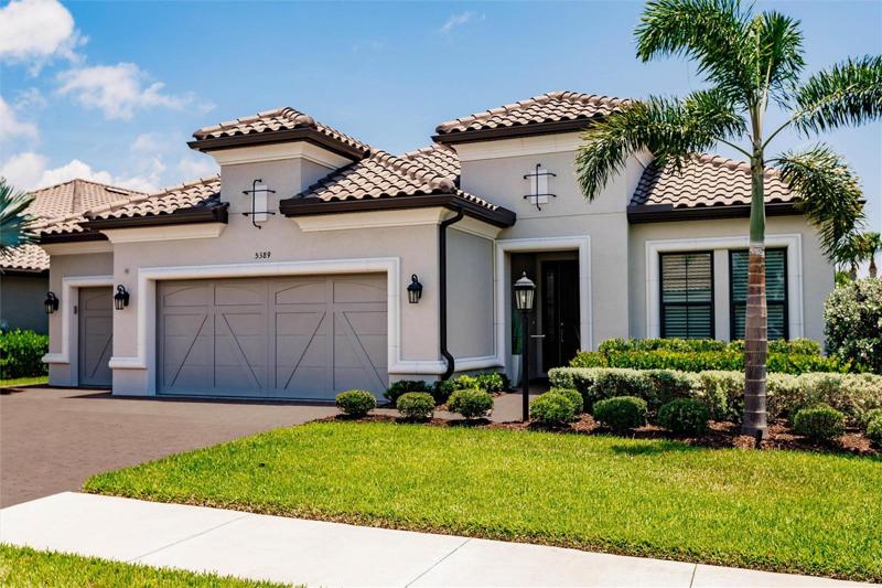 2 year old Lazio floor plan with 3 car garage.  Expanded lanai, pool, spa, outdoor fireplace and outdoor kitchen.