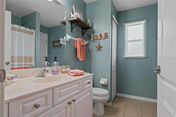 Guest Bathroom, Door leading to lanai opposite linen closet