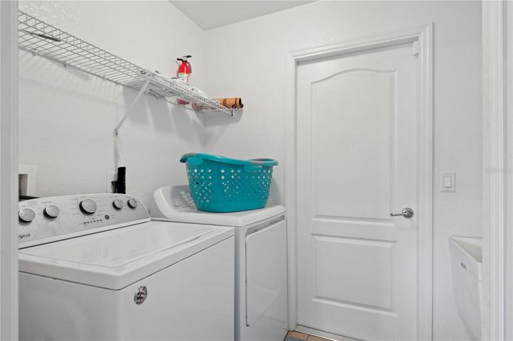 Laundry room leading to garage and to kitchen