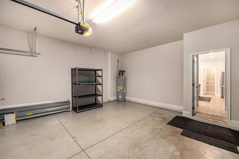 Garage with storm shutters. Shelf does not convey.