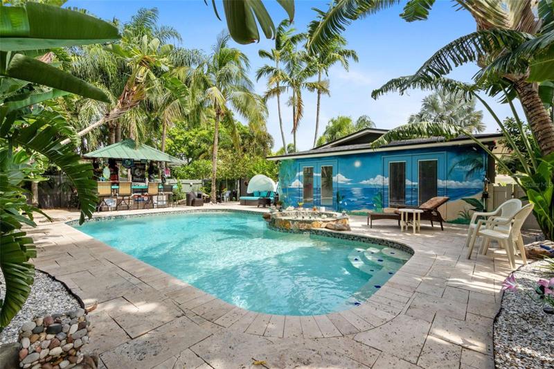 Your tropical pool and very own tiki bar are surrounded by Palm Trees that provide complete privacy!
