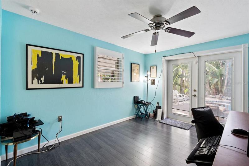 Bedroom #3 is being used as an office.  It also has the french doors leading out to the pool.