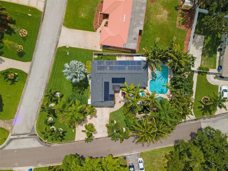 Great aerial photo of the large corner lot showing the solar panels and fabulous landscaping!