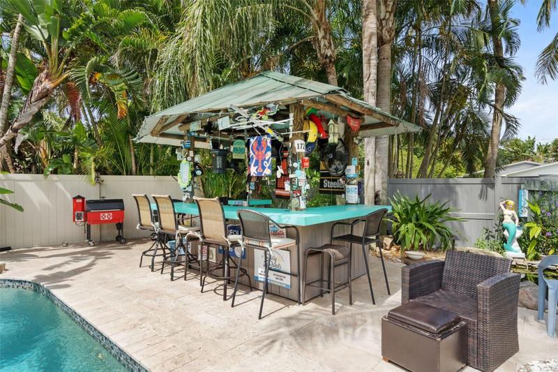 Very cool Tiki Bar with lots of bar space for fun times at your home!