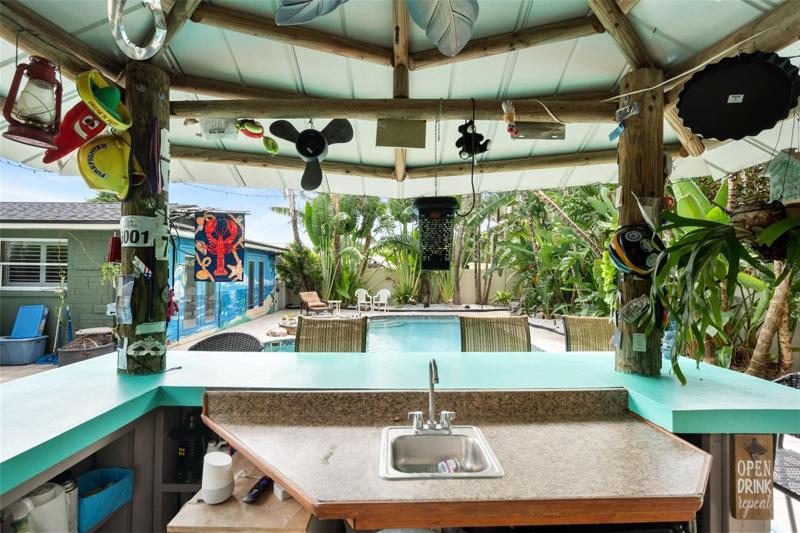 The tiki bar also has running water and electricity!