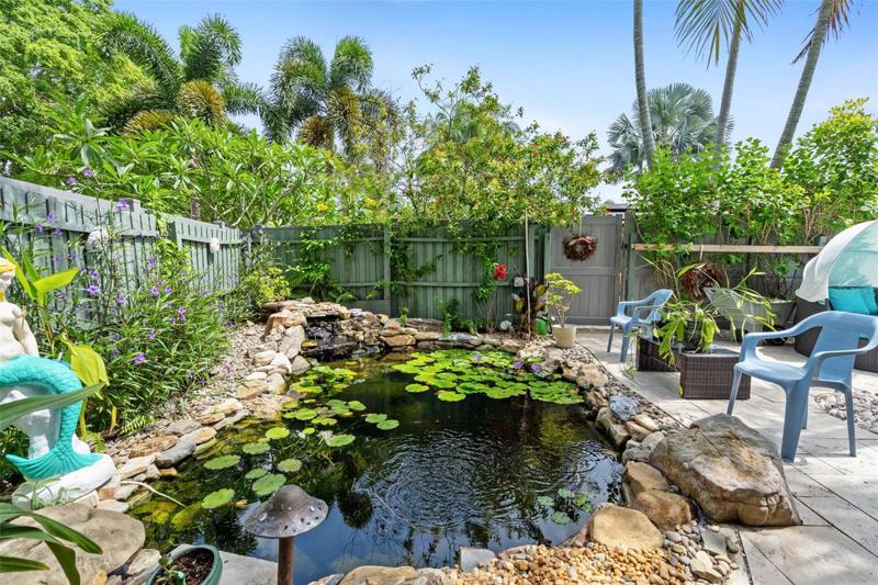 Side yard has beautiful pond with waterfall!