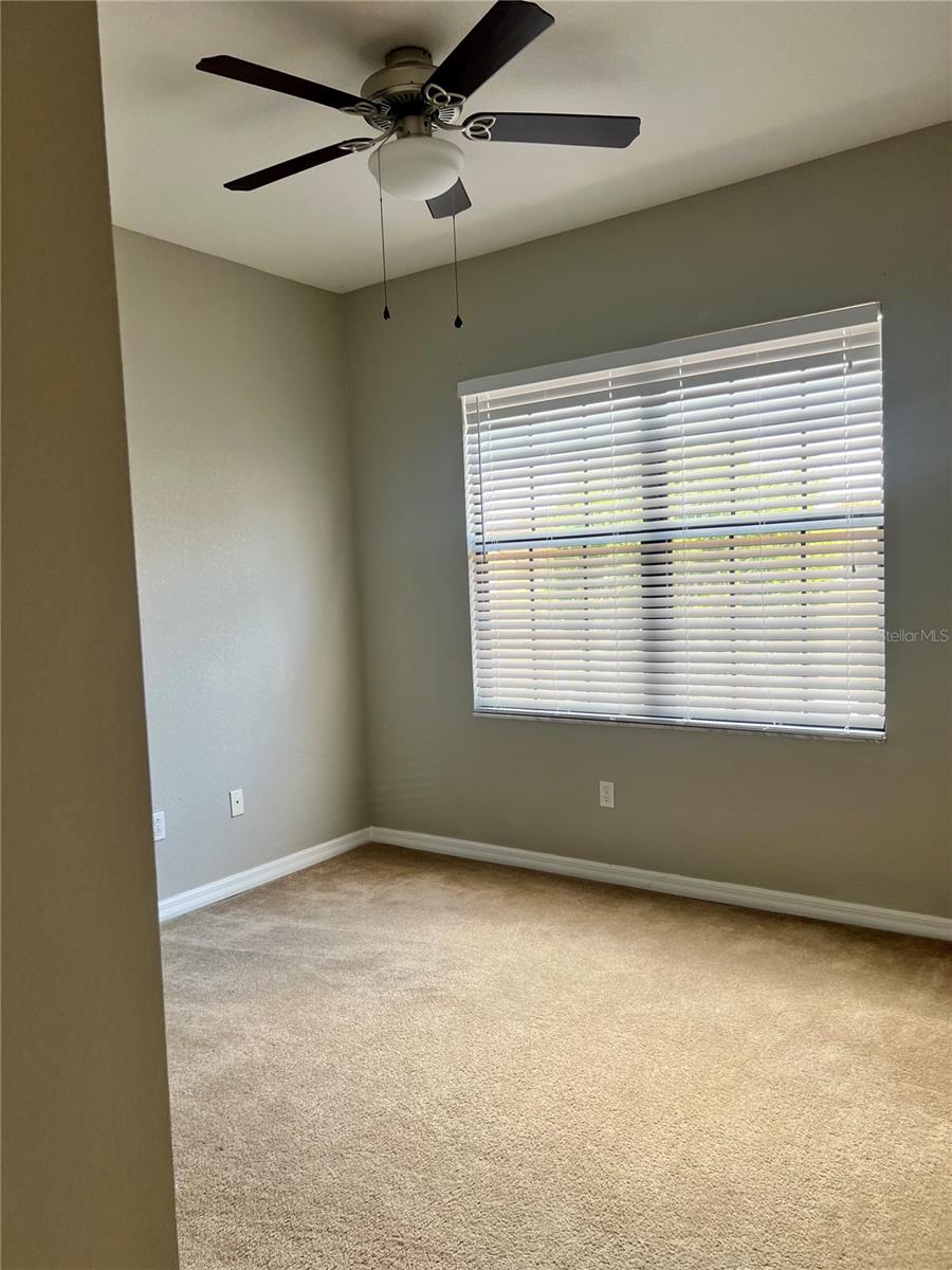 third bedroom with walk in closet