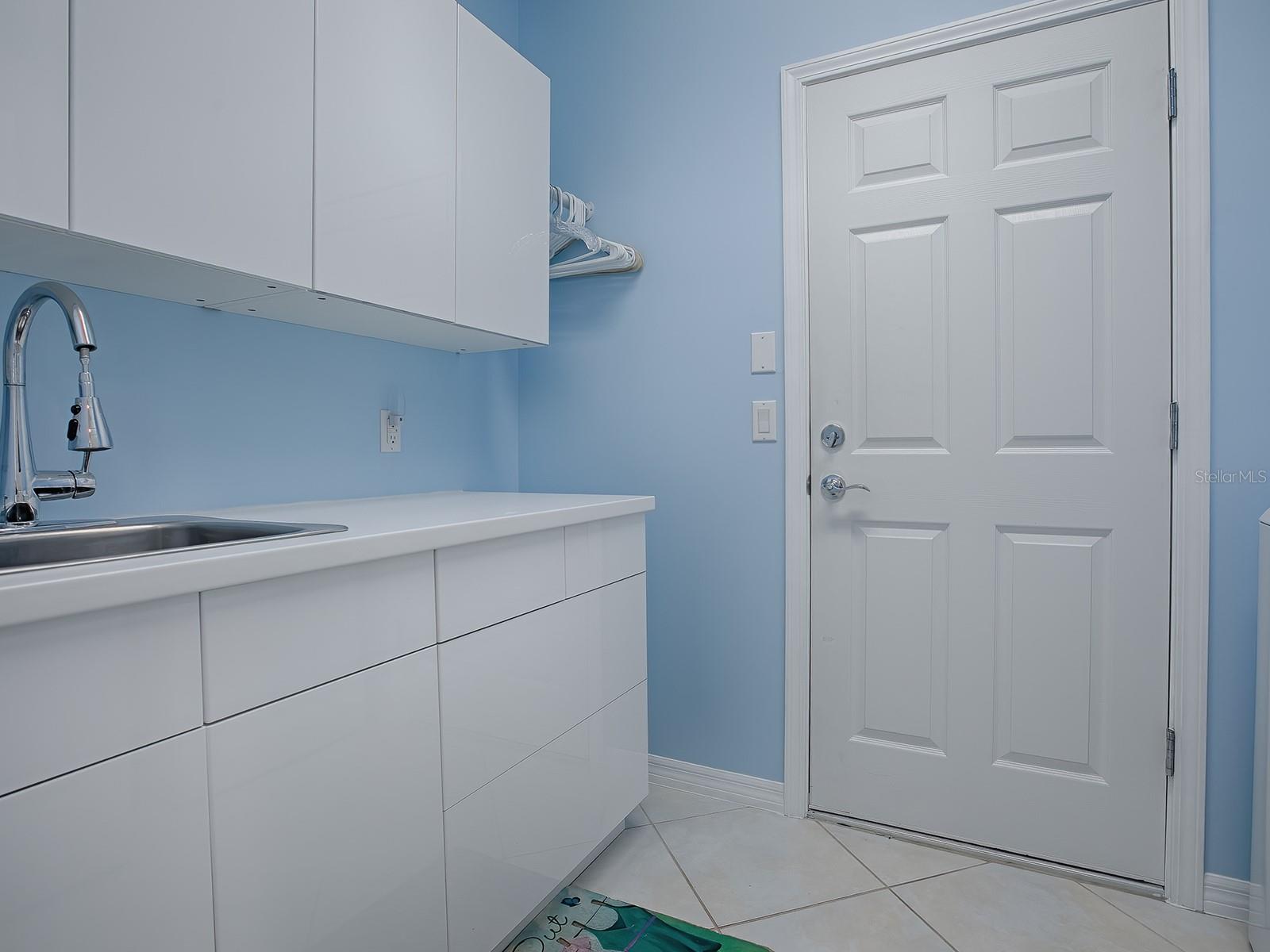 Wonderful storage and laundry sink for convenience!