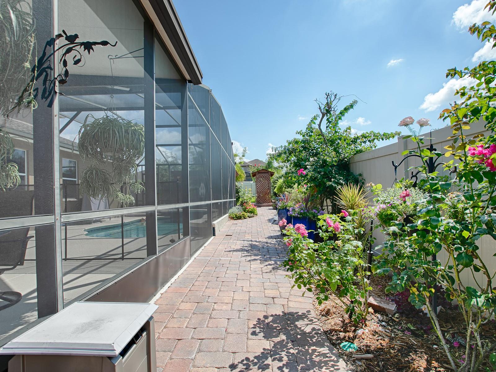 Beautiful flower beds and miniature gardens tastefully decorate the entire back yard