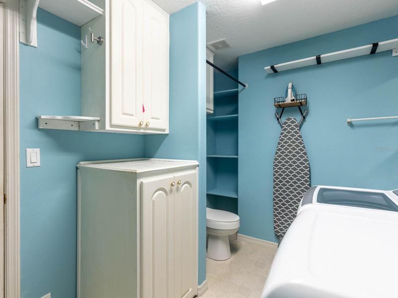 Laundry Room with extra storage and 1/2 bath