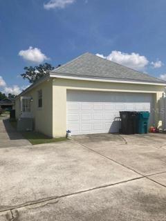 Oversized rear garage with workshop and cabinet as well as 2nd frig.