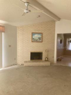 Family room off eat-in-kitchen. Brick wood-burning fireplace. Cathedral ceiling. Huge sliding doors to the pool area and deck.