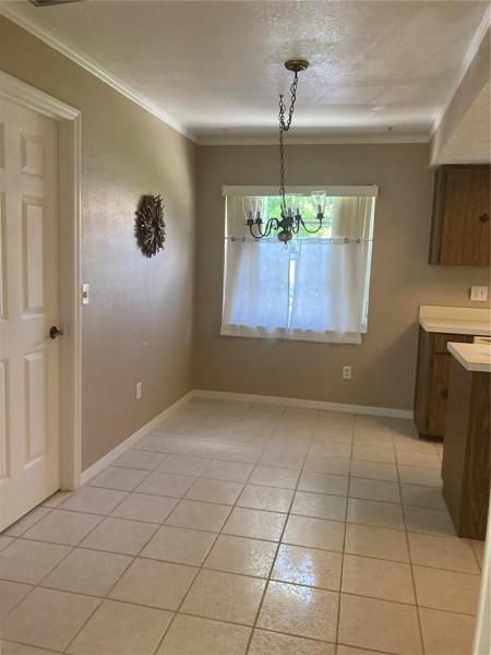 Eating space in kitchen. Door leads to inside laundry with large closet pantry.