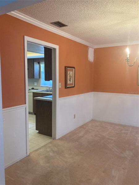 Another view of dining room leading to the kitchen.