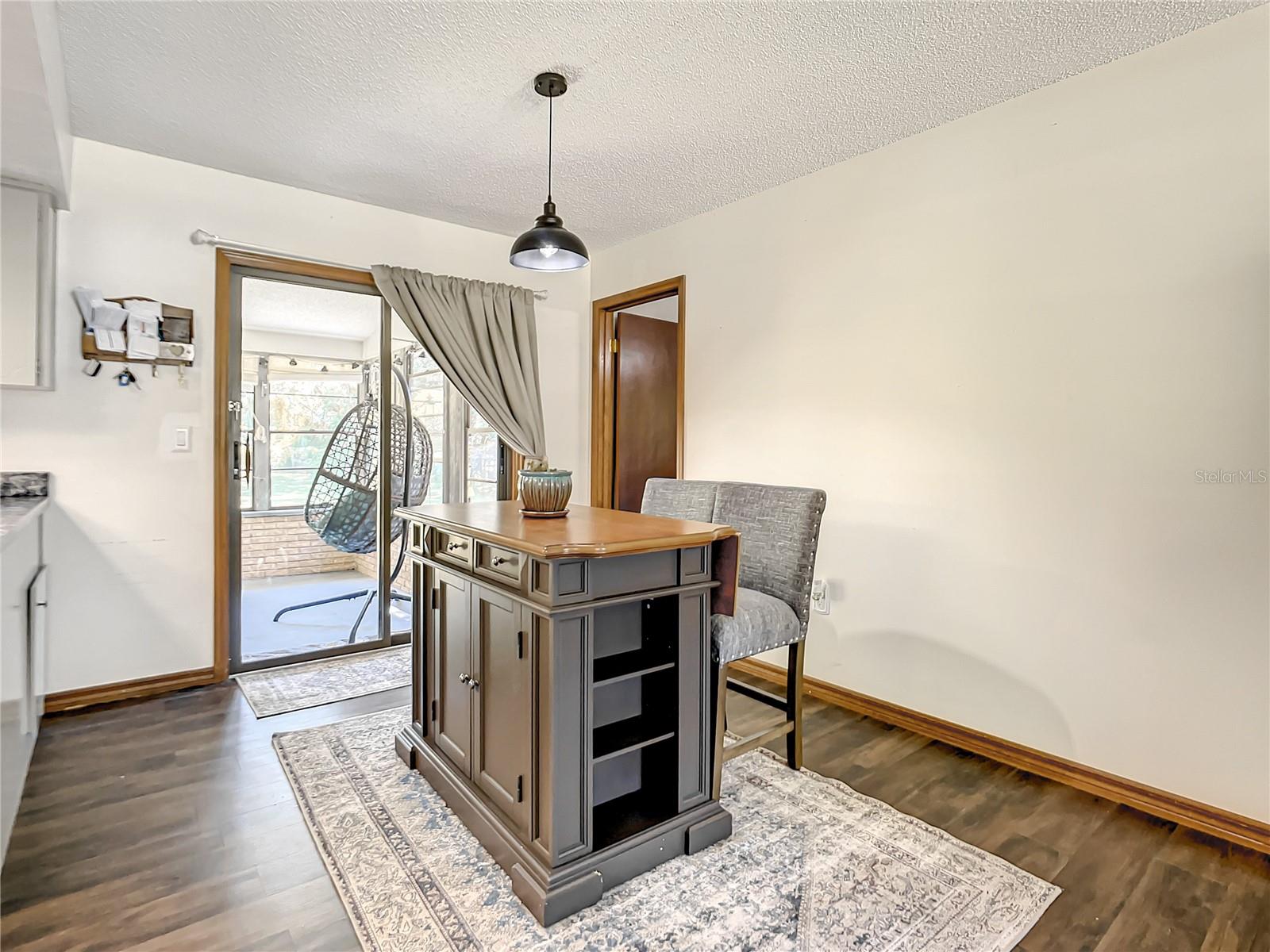 Dining Area and sliding glass to Screened Porch