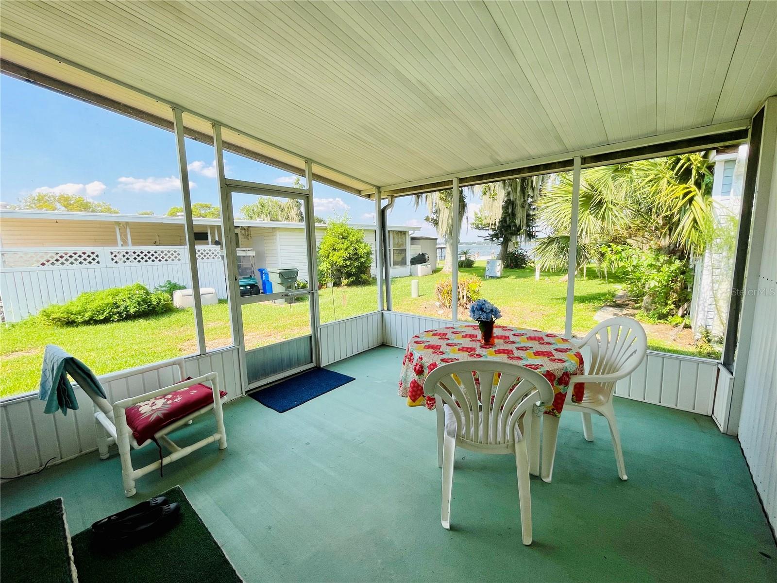 Rear screened lanai with view of Lake Gibson