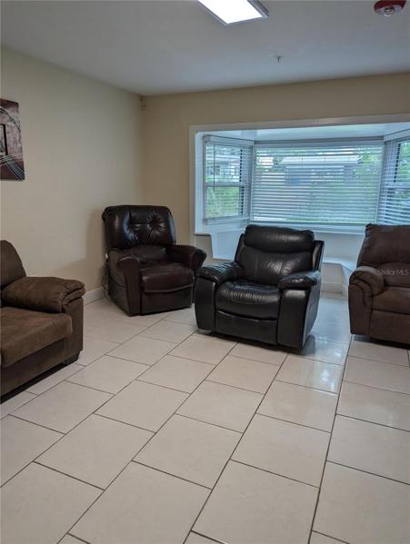 front living room with several recliners.