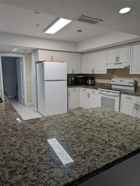 Lovely updated kitchen with granite counter tops and newer appliance